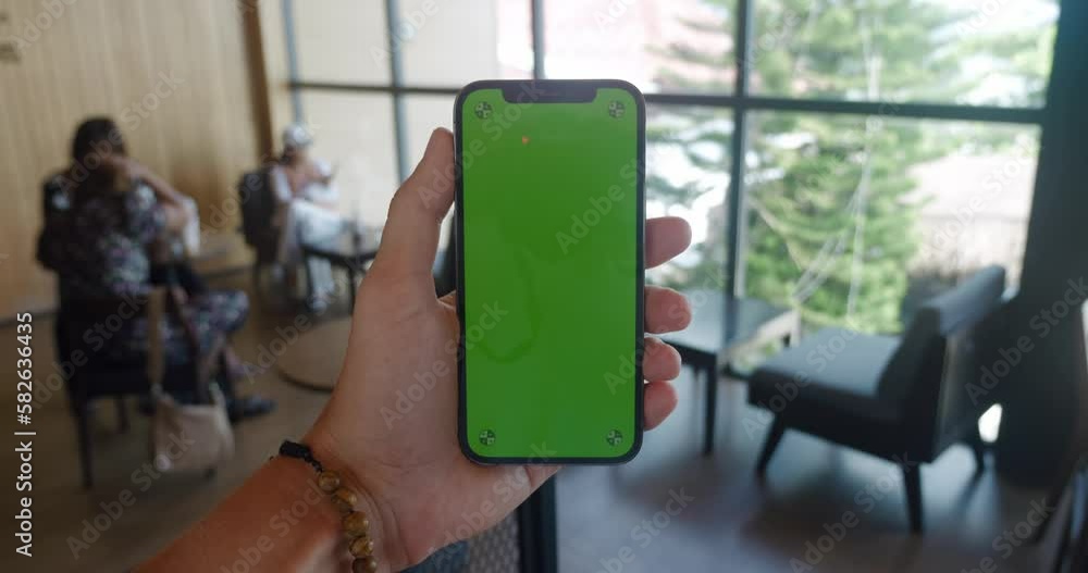 Close up man's hand holding mobile phone with green screen chroma key ...