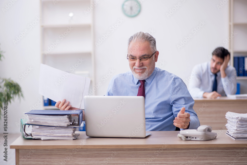 Two male colleagues working in the office Two male colleagues working in the office