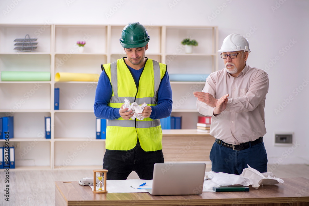 Two male architects working on the project Two male architects working on the project
