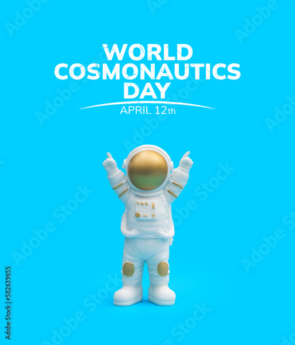 Astronaut on a blue background. World cosmonautics Day. Statuette.