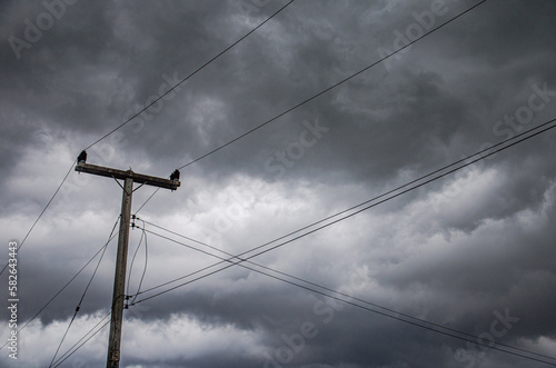 electricity pole with cloudy and storm background
