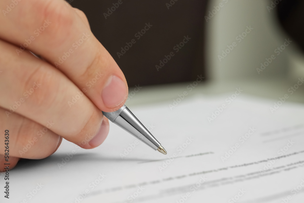 Man signing document, closeup view. Space for text Man signing document, closeup view. Space for text
