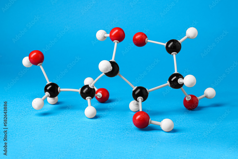 Obraz premium Molecule of glucose on light blue background. Chemical model