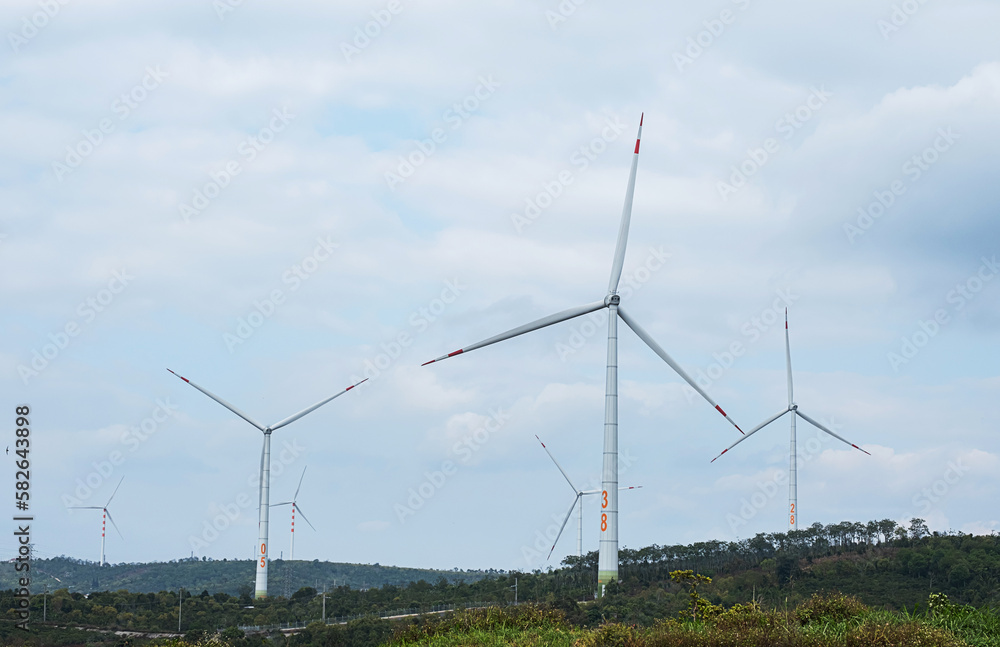 Wind generator turbines at wind farm. Alternative energy concept.