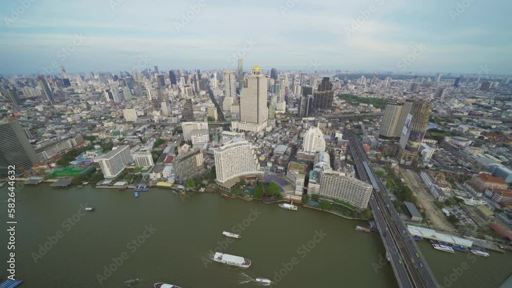 Aerial view of Bangkok Downtown Skyline, Thailand. Financial district and business centers in smart urban city in Asia. Skyscraper and high-rise buildings with Chao Phraya River. Aerial view of Bangkok Downtown Skyline, Thailand. Financial district and business centers in smart urban city in Asia. Skyscraper and high-rise buildings with Chao Phraya River.