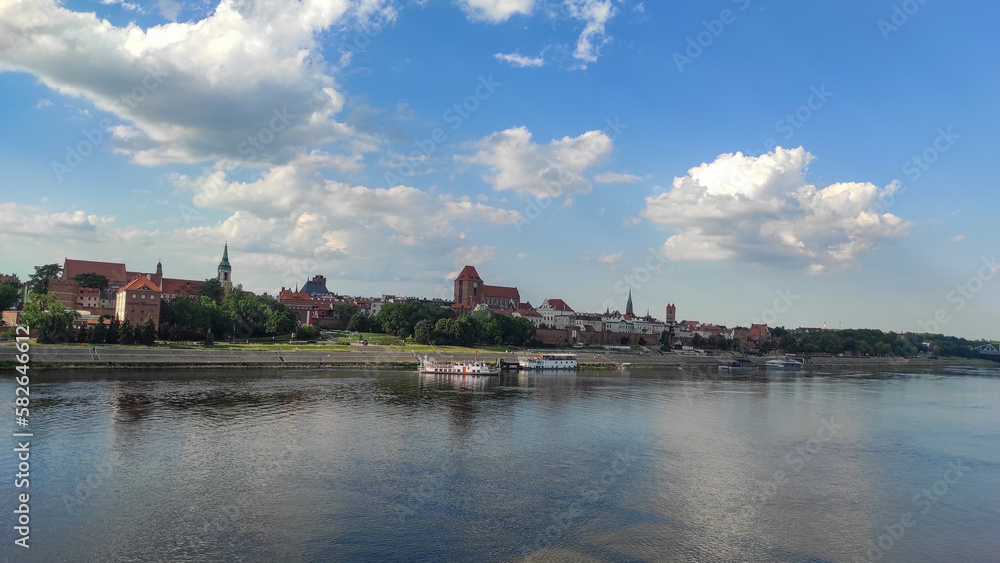 panoramic view of Old City of Torun. Vistula (Wisla) river against the backdrop of the historical buildings of the medieval city of Torun. Poland.