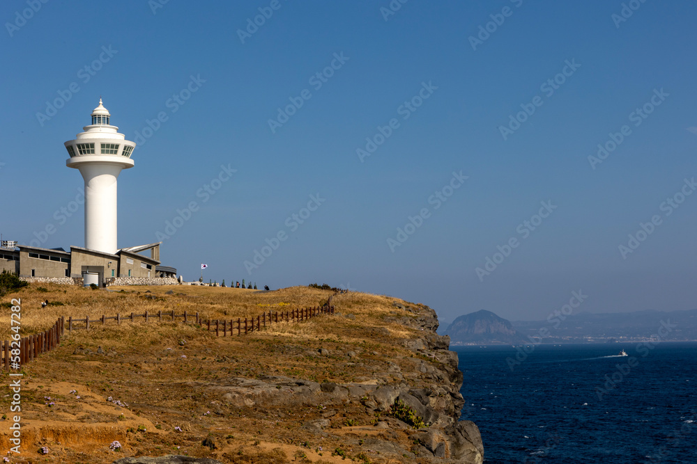 white lighthouse and blue sky