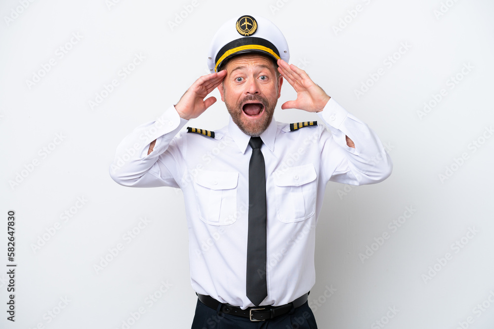 Airplane middle age pilot isolated on white background with surprise expression