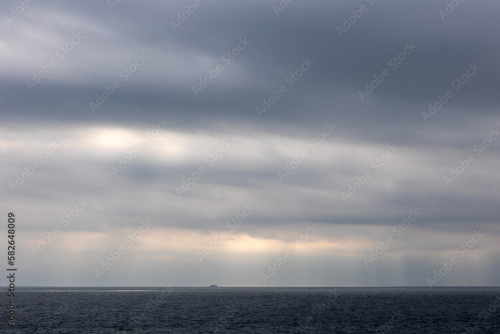 Dark clouds and shining sea
