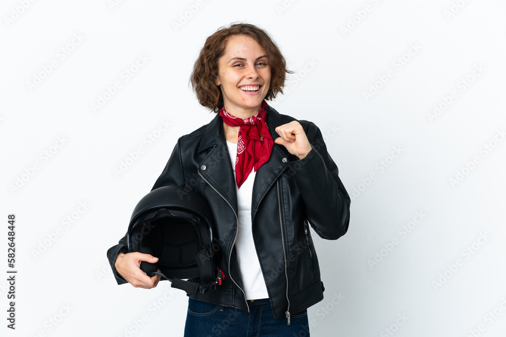 English woman holding a motorcycle helmet isolated on white background proud and self-satisfied English woman holding a motorcycle helmet isolated on white background proud and self-satisfied