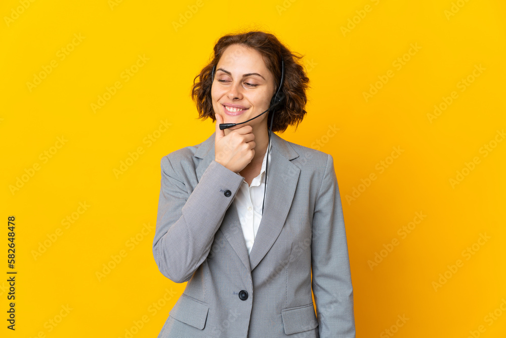Young English woman isolated on yellow background looking to the side and smiling Young English woman isolated on yellow background looking to the side and smiling