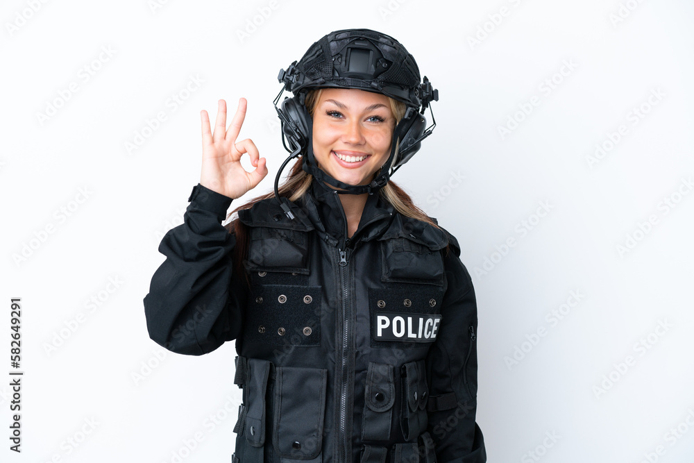 SWAT Russian woman isolated on white background showing ok sign with fingers SWAT Russian woman isolated on white background showing ok sign with fingers