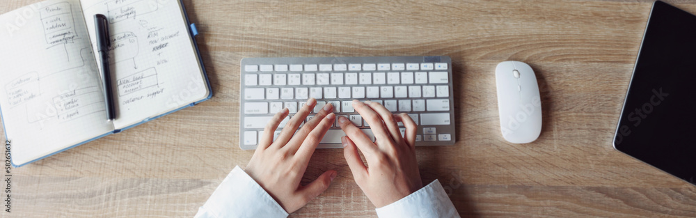 Close up of business woman hands working using keyboard of computer in office workplace Close up of business woman hands working using keyboard of computer in office workplace