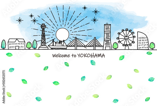 エコロジーイメージの大阪の観光地の街並みと緑の葉