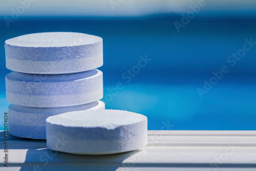 cleaning and maintenance of swimming pools with chlorine tablets photo