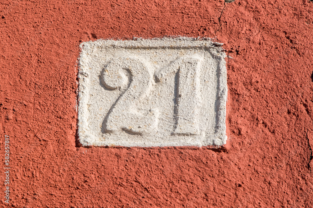 Old retro weathered cast iron plate with number 21 Old retro weathered cast iron plate with number 21