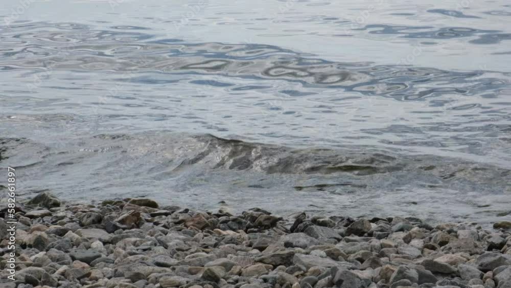 Waves calmly washing up rocky sea beach. Seashore. Calm, Meditation, travel Waves calmly washing up rocky sea beach. Seashore. Calm, Meditation, travel