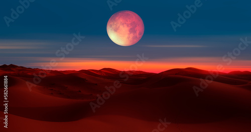 Beautiful sand dunes in the Sahara desert at sunrise with super full moon - Sahara  Morocco  Elements of this image furnished by NASA 