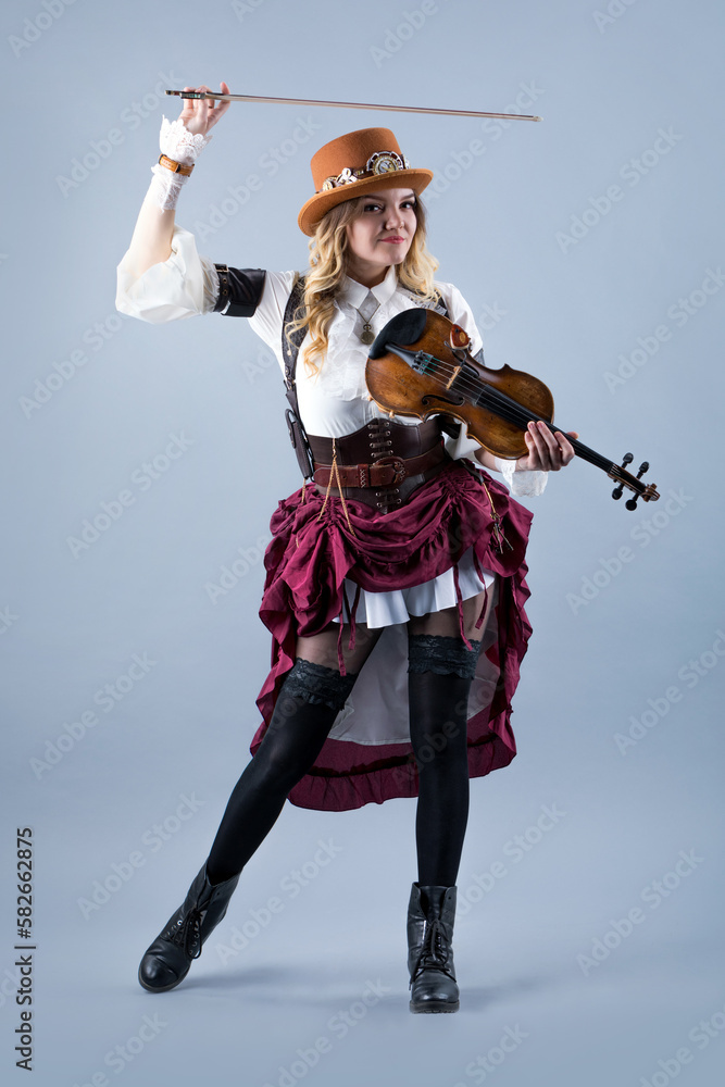 Country girl with violin on the grey background. Country girl with violin on the grey background.
