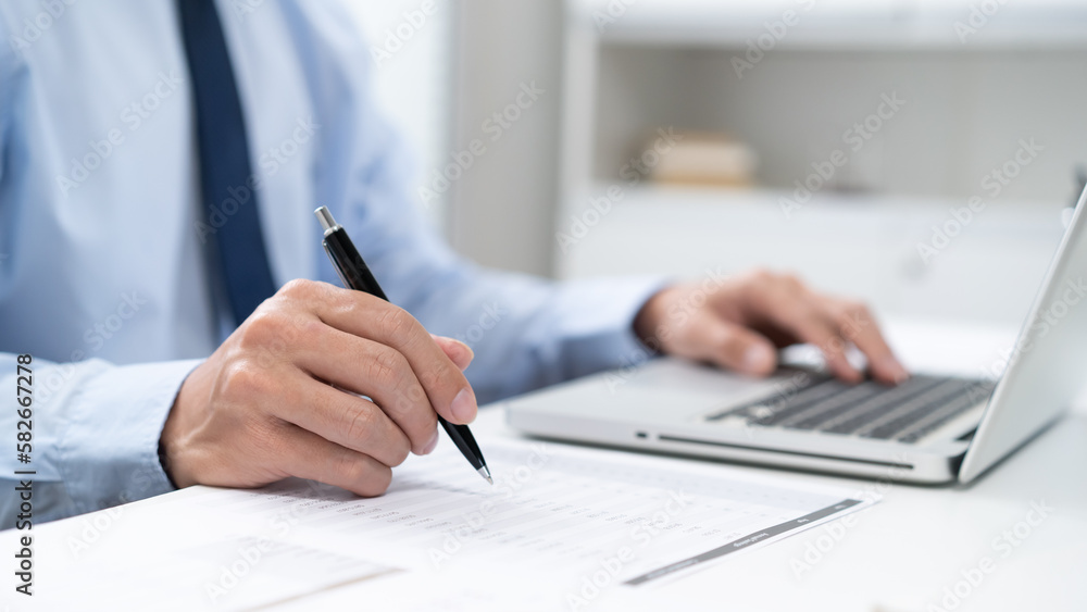 Business man working by using laptop computer Hands typing on a keyboard. Professional investor working new start up project. business planning in office. Technology business Business man working by using laptop computer Hands typing on a keyboard. Professional investor working new start up project. business planning in office. Technology business