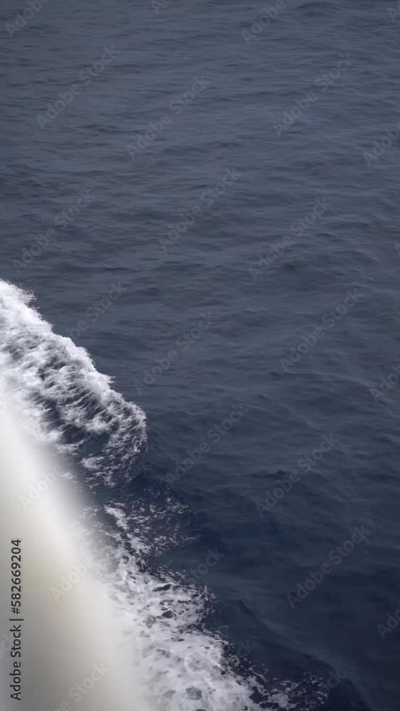 Vertical video of the vast blue Adriatic sea view from a sailing boat in Croatia