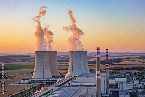 Sunrise over the Dukovany nuclear power plant with cooling towers in the Czech Republic photo