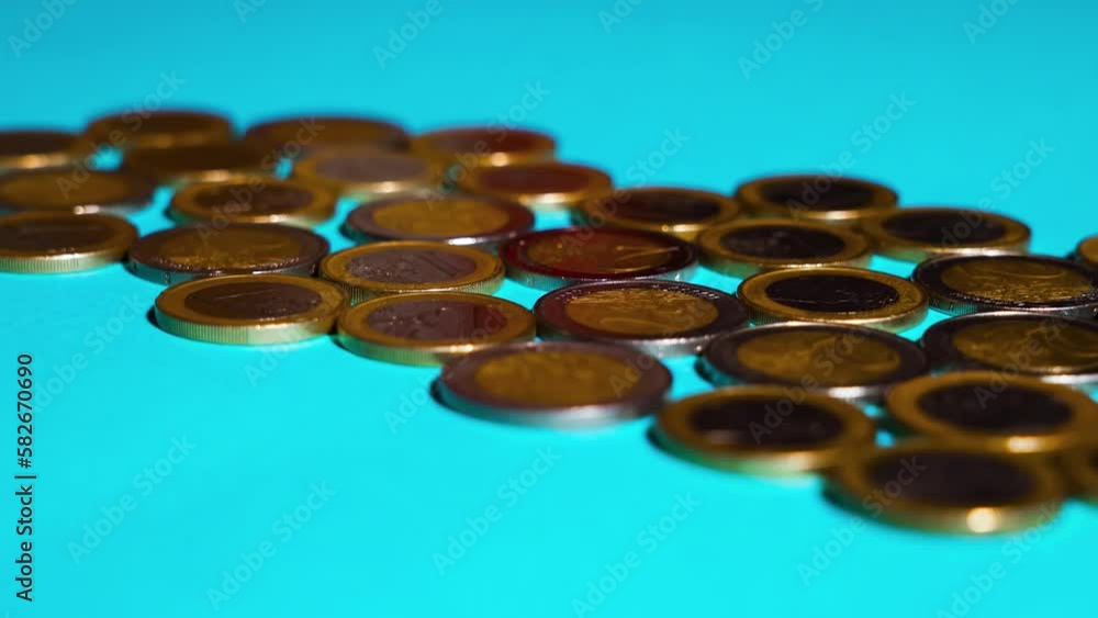Euro coins on the blue floor Euro coins on the blue floor