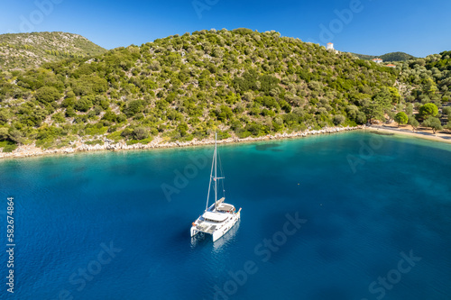 Aerial view of a moored yacht near Dexia beach on Itaca island, Greece photo