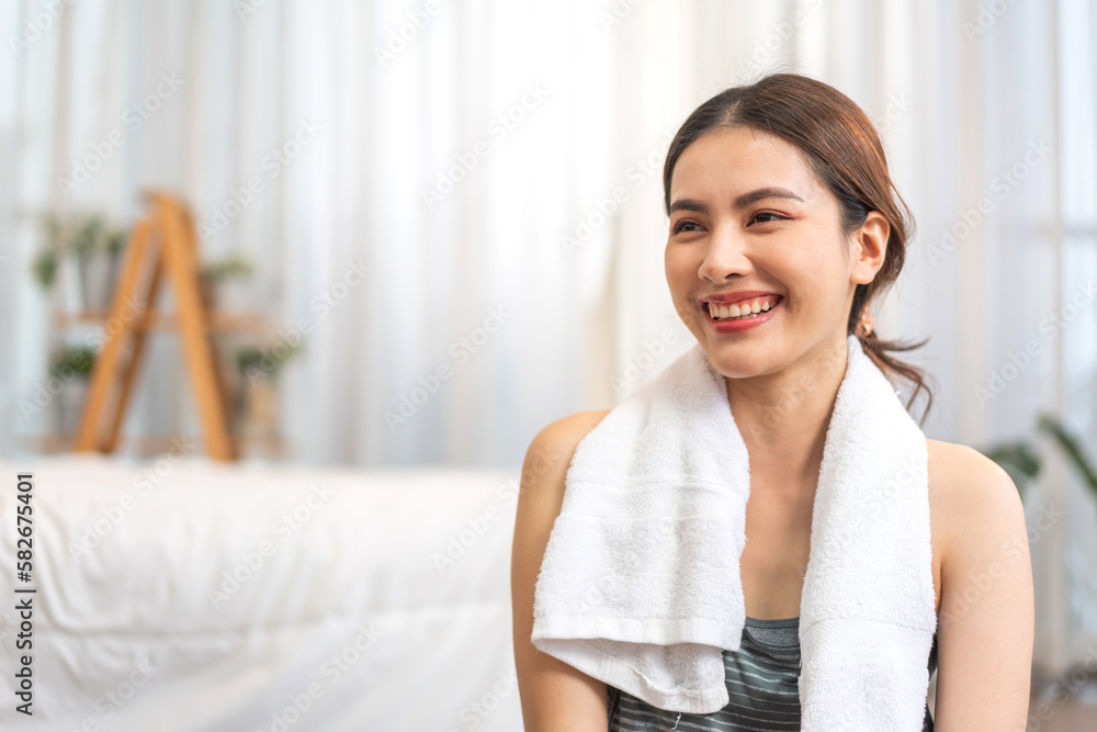 Portrait smiling happy sport asian beauty body slim woman in sportswear sitting relax and practicing yoga and do fitness exercise pose in bedroom at home.Diet concept.Fitness and healthy Portrait smiling happy sport asian beauty body slim woman in sportswear sitting relax and practicing yoga and do fitness exercise pose in bedroom at home.Diet concept.Fitness and healthy