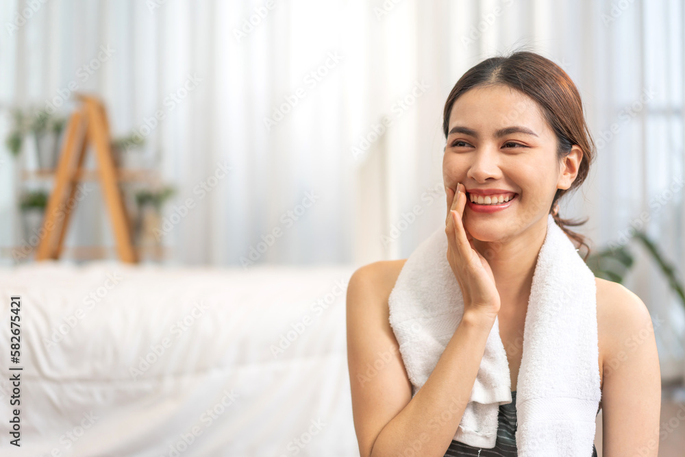 Portrait smiling happy sport asian beauty body slim woman in sportswear sitting relax and practicing yoga and do fitness exercise pose in bedroom at home.Diet concept.Fitness and healthy Portrait smiling happy sport asian beauty body slim woman in sportswear sitting relax and practicing yoga and do fitness exercise pose in bedroom at home.Diet concept.Fitness and healthy