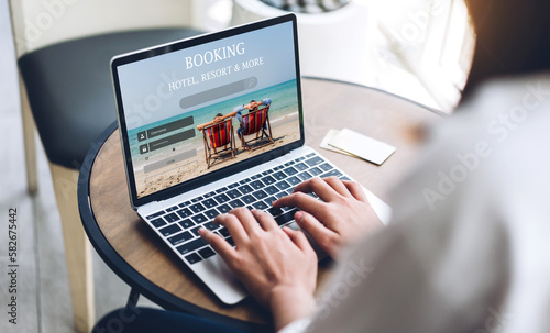 Slika na platnu Portrait of woman use technology of laptop computer for hotel and resort booking online summer holiday travel system plan searching information weekend vacation trip