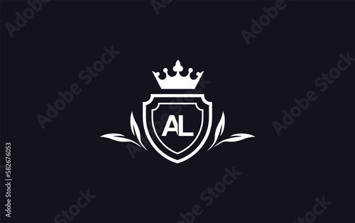 Shield with crown icon and Royal luxury crown monogram symbol. King with laurel wreath queen and crown logo design symbol