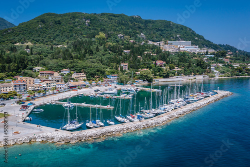 Obraz na płótnie Sailing boats in Benitses village on the Ionian Sea shore, Corfu Island, Greece w salonie