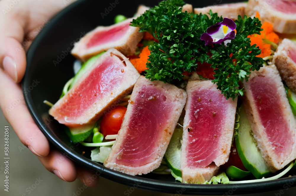 Fresh Tuna Salad Served with Cucumber Roe and Tomato Lettuce Garnished with Salad and Sesame Oil Sauce Fresh Tuna Salad Served with Cucumber Roe and Tomato Lettuce Garnished with Salad and Sesame Oil Sauce