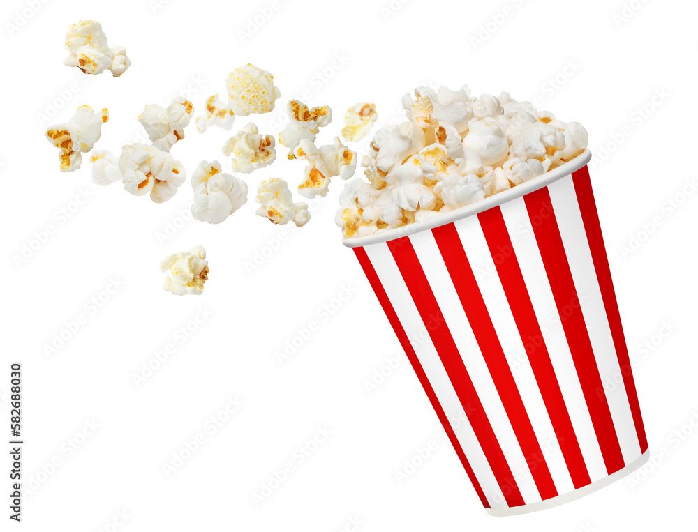 Delicious popcorn flying out of red striped carton cup, cut out Delicious popcorn flying out of red striped carton cup, cut out