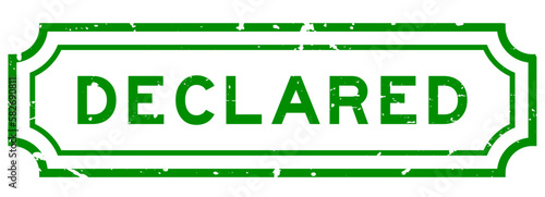Grunge green declared word rubber seal stamp on white background