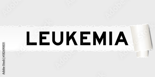 Ripped gray paper background that have word leukemia under torn part