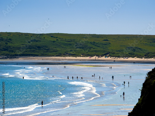 Shallow beach at afternoon (Tenby, Wales, United Kingdom, in summer) Fototapet