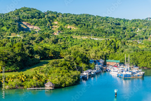A view from the cruise terminal of boats moored on Roatan Island on a sunny day
