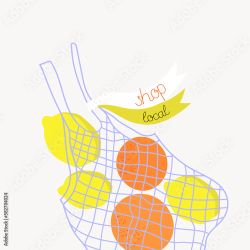 Shop local. Shopping mesh bag with fruits  on a grey background.