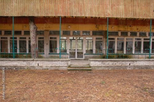 Dilapidated and abandoned building, roofing and terrace on an autumn day. Urbex, photo