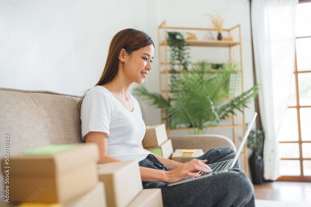 Asian woman preparing package delivery box Shipping for shopping online. young start up small business owner Asian woman preparing package delivery box Shipping for shopping online. young start up small business owner