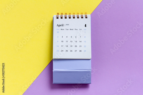 Desktop calendar for April 2023. Calendar for planning on a colored background.