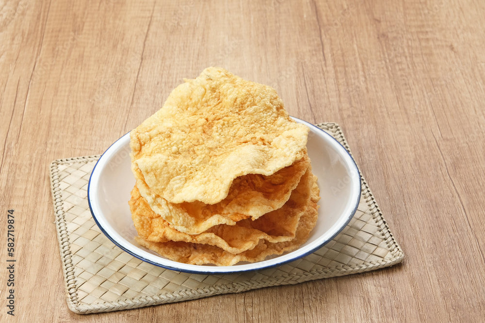 Emping, Indonesian traditional snack made from melinjo or belinjo seeds. Bitter and sweet taste
Emping, Indonesian traditional snack made from melinjo or belinjo seeds. Bitter and sweet taste
