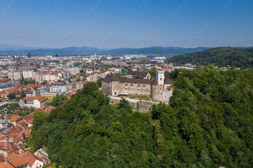 Ljubljana Castle and old town in Slovenia. Ljubljana is the largest city. It's known for its university population and green spaces, including expansive Tivoli Park. The curving Ljubljanica River