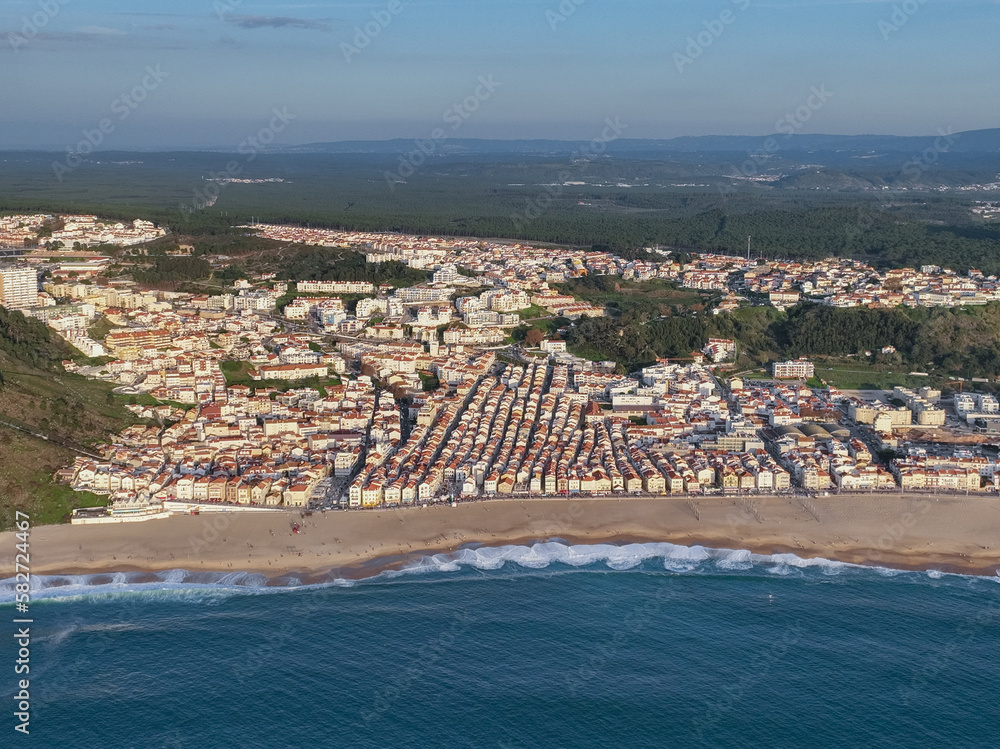 Obraz premium Nazare Town in Portugal. Beach and Cityscape. Drone Point of view.