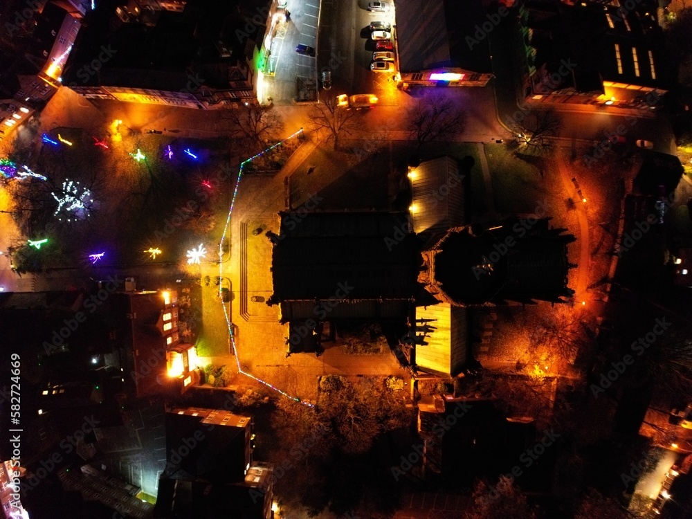 Flying over the church at night, with festive lights