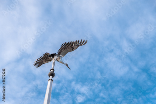 VISAGINAS, LITHUANIA - SEPTEMBER 23, 2017: Stork Statue in Visaginas Town, Lithuania photo