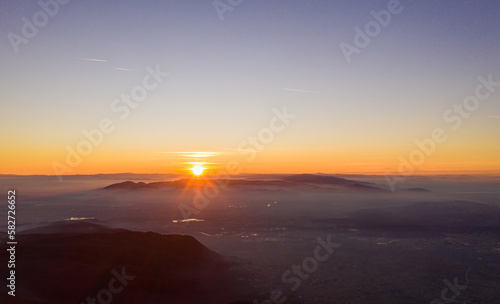 Zagreb Skyline in Croatia. Sunset Light Colorful Sky and Castle in Background. View from the top of Medvednica Mountain. Haze Background. Sightseeing Place