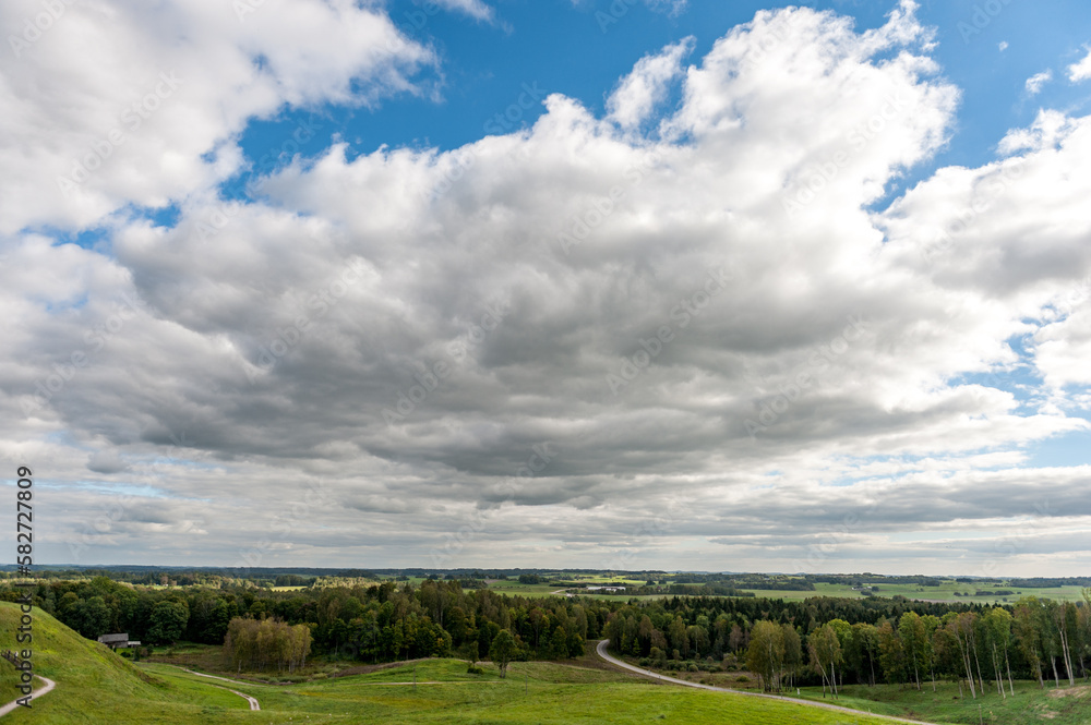 Medvegalis hill in Lithuania. Nature and Landscape with cloudy blue sky